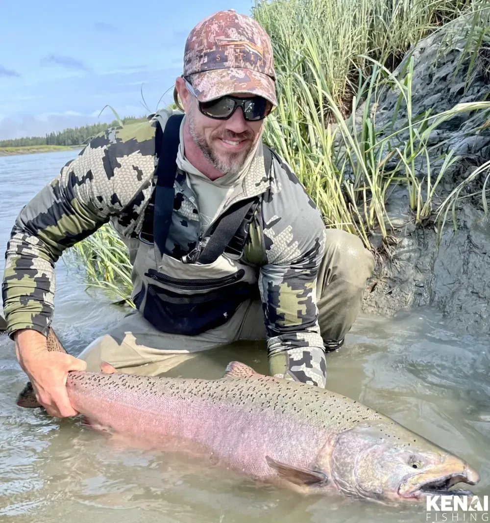 King salmon held at the side of drift boat
