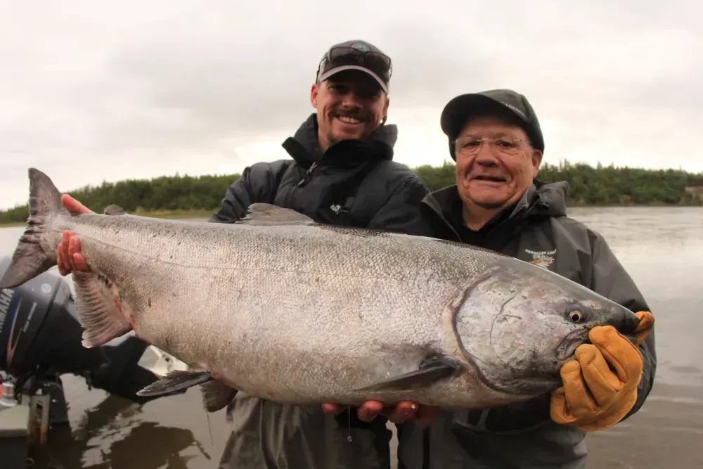 Trophy king salmon with guide and client